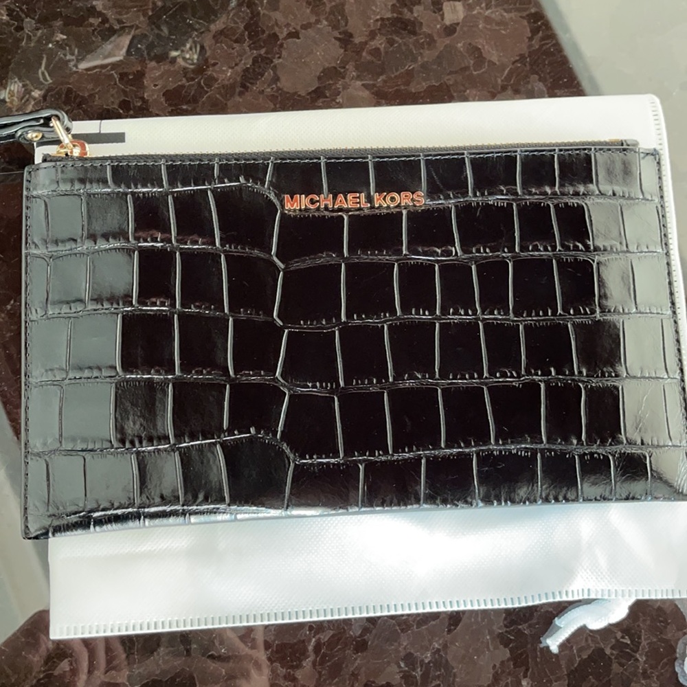 Michael Kors Croc Embossed leather wristlet.